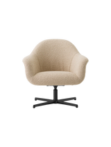 Front view of the Harbour Lounge Chair upholstered in light beige bouclé fabric with a black star swivel base.
